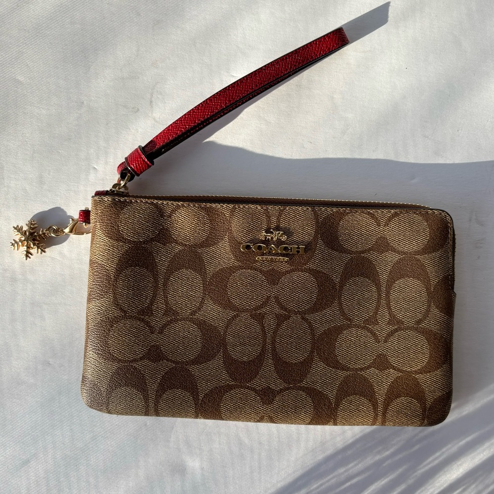Tan Coach Signature Print Leather Wristlet Holiday Edition with Snowflake Charm